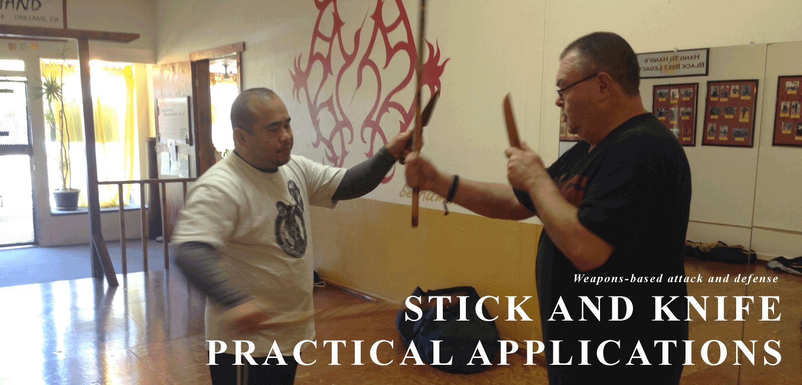 two students doing stickfighting, text label: Practical Defenses Against Armed Attack